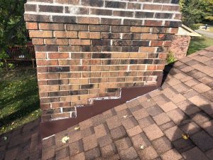 BEFORE: Chimney flashing repair